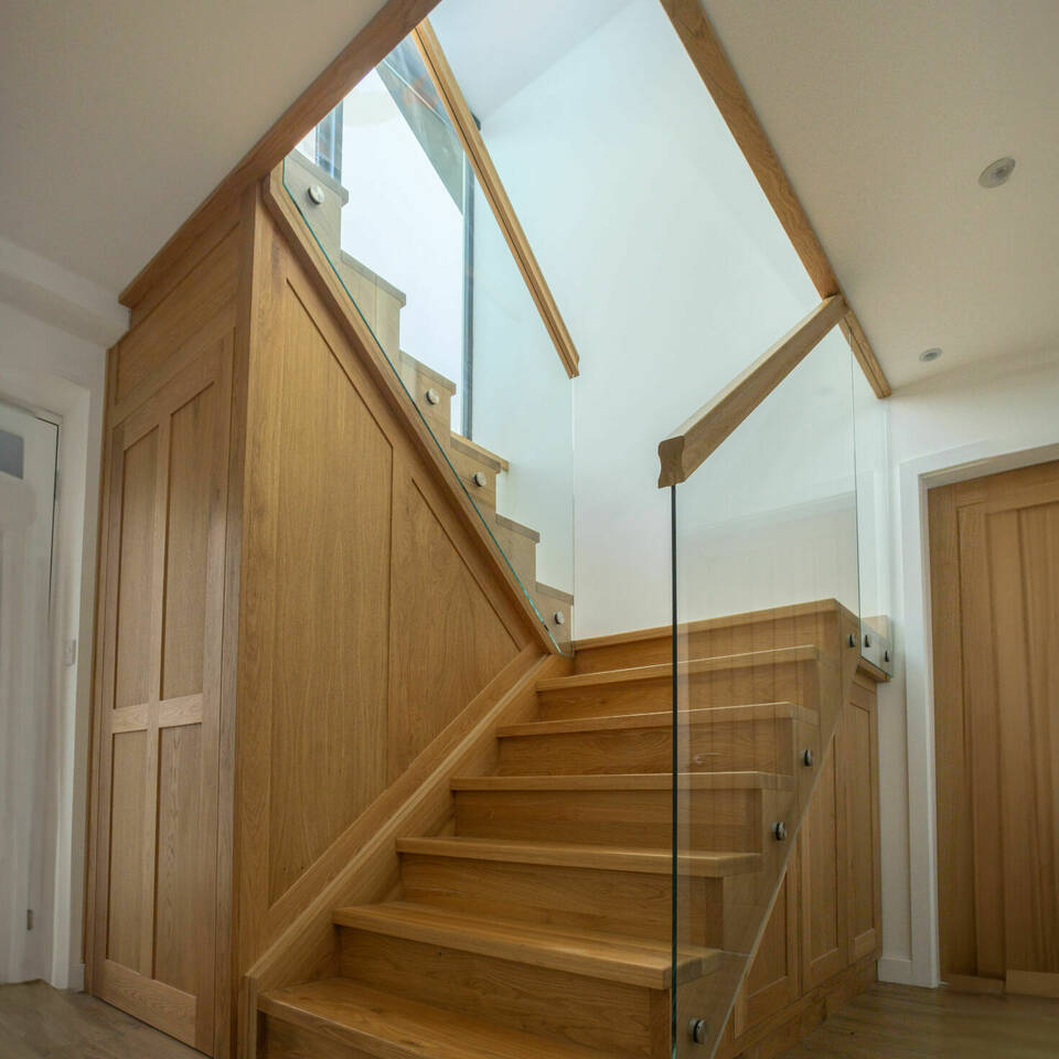 Contemporary Glass and Oak Staircase with Integrated Storage