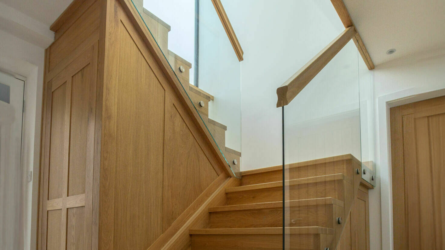 Contemporary Glass and Oak Staircase with Integrated Storage